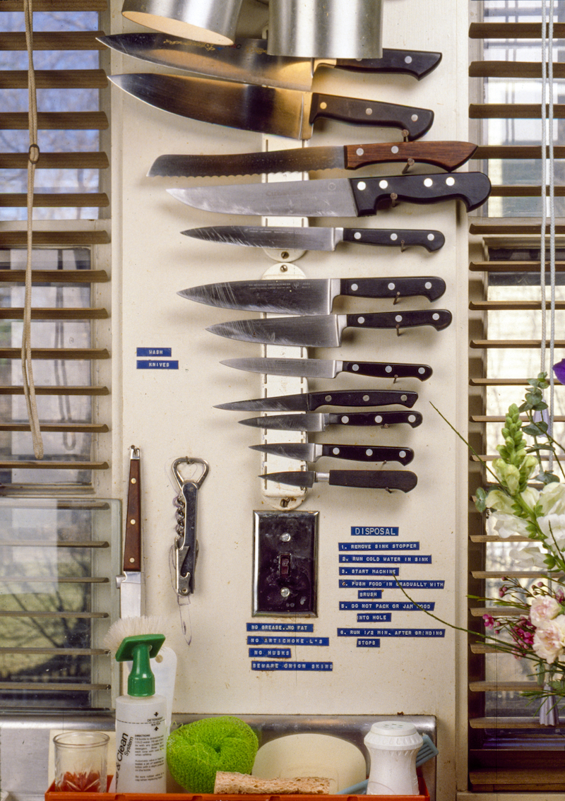 Detail of magnetic knife storage by window.