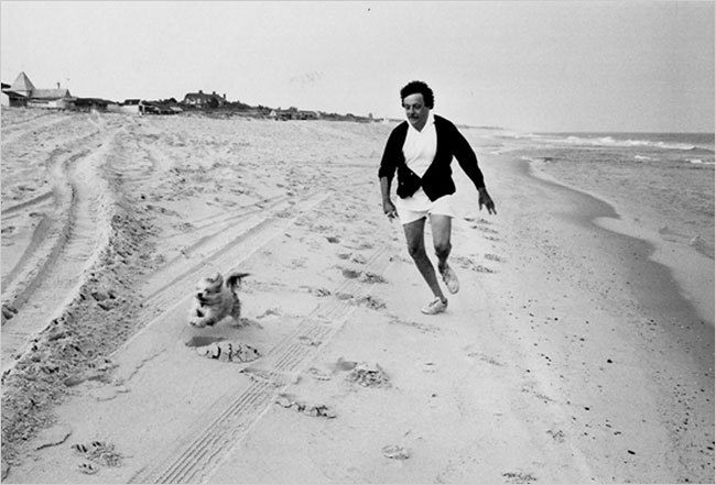 Kurt Vonnegut with dog on beach
