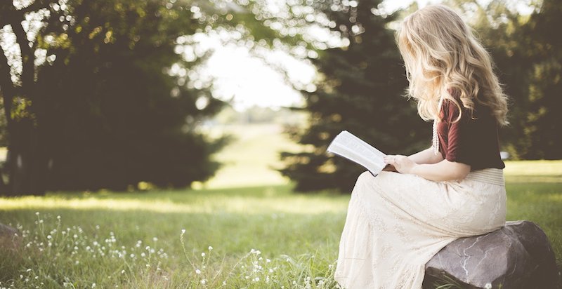 blond woman reading