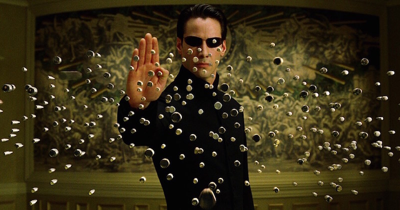 Neo stopping bullets in The Matrix, one of the most famous movies about a dystopian society