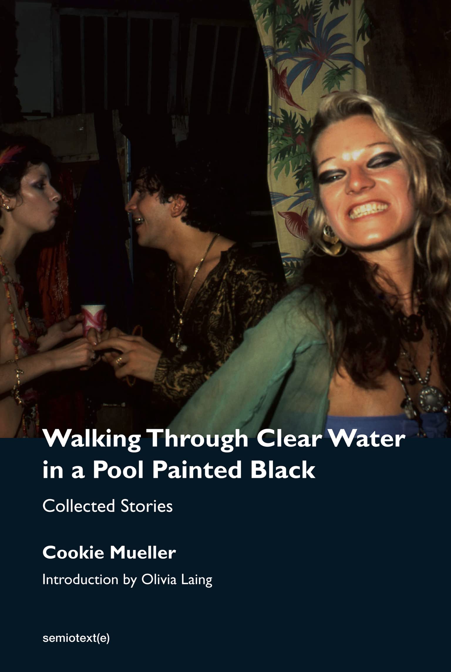 cookie mueller_walking through clear water in a pool painted black