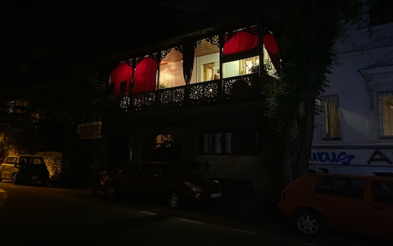 It’s my first night in Tbilisi, July 2022, and I’m in the backseat of a taxi looking at hills and crumbling ten-story buildings on my way to my fr