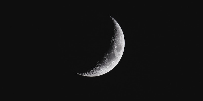 Catch a glimpse of the half-lit moon in its third quarter phase