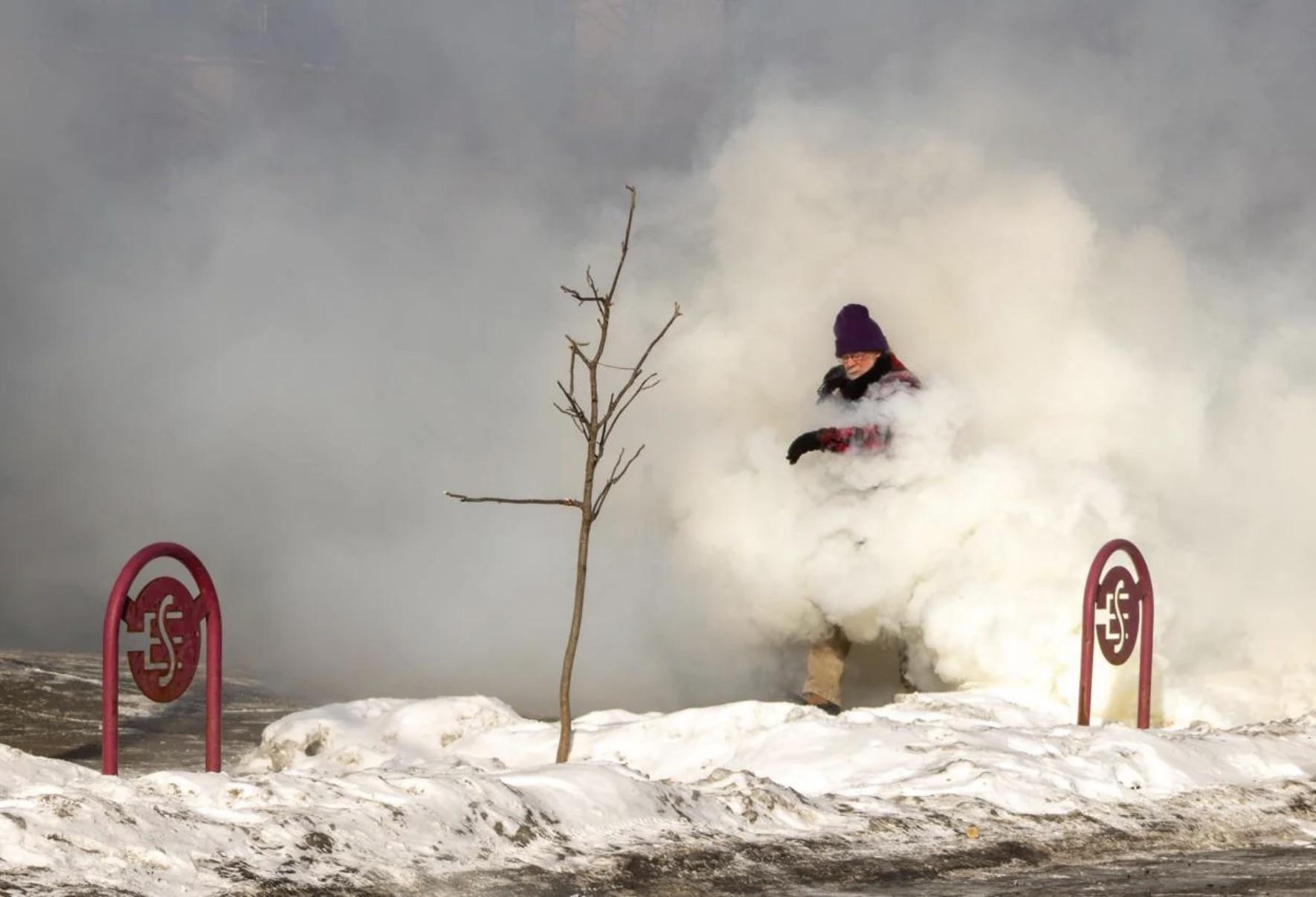 Greg Ketter walking through tear gas. Photo by Theia Chattelle.
